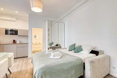 Un ou plusieurs lits dans un hébergement de l'établissement New & Design 1bd Flat in the Heart of le Marais