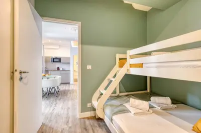 Un ou plusieurs lits dans un hébergement de l'établissement New & Design 1bd Flat in the Heart of le Marais