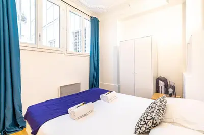Un ou plusieurs lits dans un hébergement de l'établissement GuestReady - Lovely Parisian Apartment for 4pax.