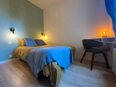 Un ou plusieurs lits dans un hébergement de l'établissement Magnifique appartement T2 aux portes de Paris