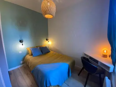 Un ou plusieurs lits dans un hébergement de l'établissement Magnifique appartement T2 aux portes de Paris
