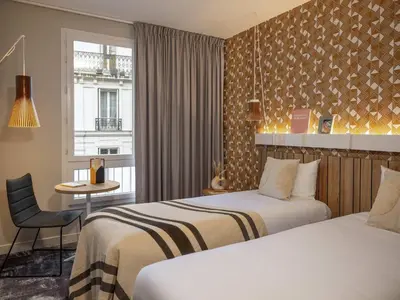 Un ou plusieurs lits dans un hébergement de l'établissement Ibis Paris Gare Montparnasse Catalogne