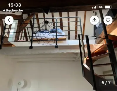 Un ou plusieurs lits dans un hébergement de l'établissement Cosy appartement quartier Latin Rue Mouffetard