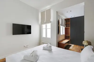 Un ou plusieurs lits dans un hébergement de l'établissement Pick A Flat's Apartment in Montorgueil - Rue Saint Joseph