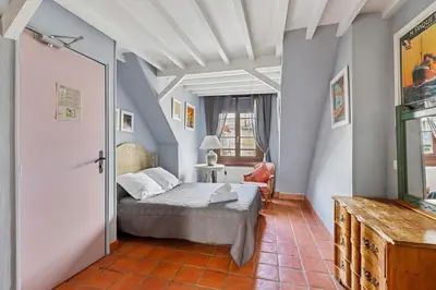Un ou plusieurs lits dans un hébergement de l'établissement Hotel de Nesle