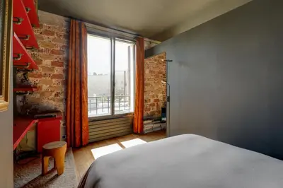 Un ou plusieurs lits dans un hébergement de l'établissement Appartement Palais Royal