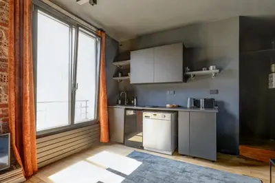 Cuisine ou kitchenette dans l'établissement Appartement Palais Royal