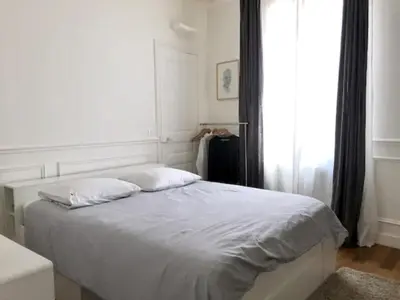 Un ou plusieurs lits dans un hébergement de l'établissement Paris charm suite authentique, quartier latin, 2/4 pers