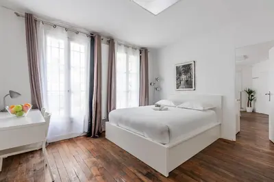 Un ou plusieurs lits dans un hébergement de l'établissement Appartement Magenta Quest