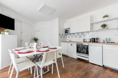 Cuisine ou kitchenette dans l'établissement Appartement Magenta Quest