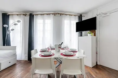Télévision ou salle de divertissement dans l'établissement Appartement Magenta Quest