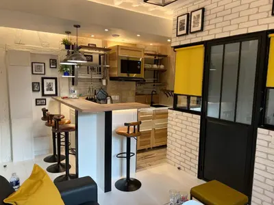 Cuisine ou kitchenette dans l'établissement Au Passage des Marais - City Centre