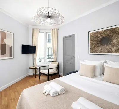 Un ou plusieurs lits dans un hébergement de l'établissement Montparnasse - Deluxe apartment with lift for 5
