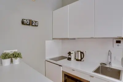 Cuisine ou kitchenette dans l'établissement Charmant studio au coeur de Paris pour 2 personnes by Weekome