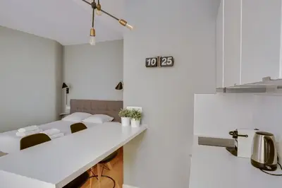 Un ou plusieurs lits dans un hébergement de l'établissement Charmant studio au coeur de Paris pour 2 personnes by Weekome