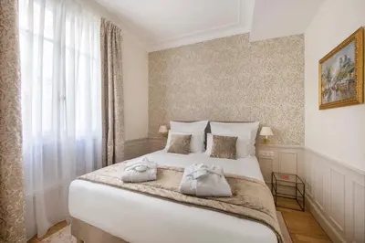 Un ou plusieurs lits dans un hébergement de l'établissement LE BEAU MARAIS - Luxury Apartments, AIR COND, LIFT
