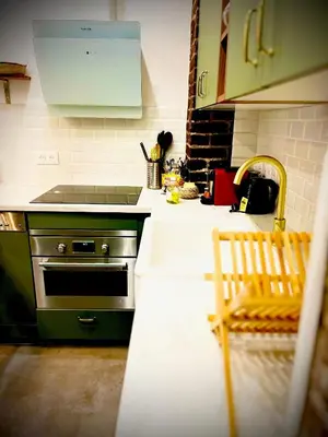 Cuisine ou kitchenette dans l'établissement Appartement élégant - 2 chambres - 2 salles de bain