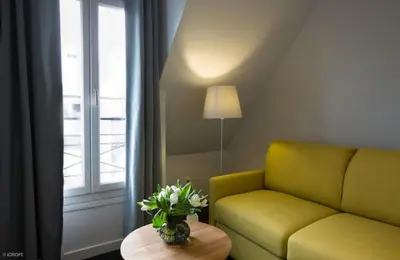 Coin salon dans l'établissement Hotel Mirabeau Eiffel