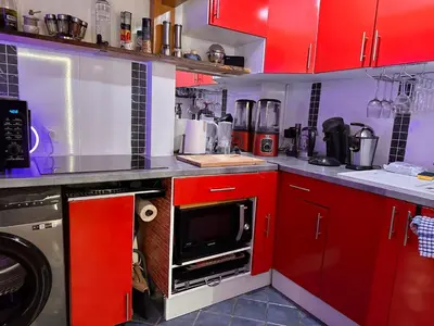 Cuisine ou kitchenette dans l'établissement Magnifique studio au coeur du Marais