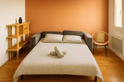 Un ou plusieurs lits dans un hébergement de l'établissement Home Sweet Home Champs Elysées Niel