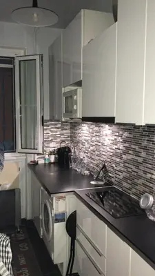 Cuisine ou kitchenette dans l'établissement Superbe appartement proche de la butte Montmartre