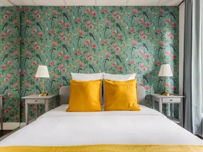 Un ou plusieurs lits dans un hébergement de l'établissement Merveil - Family Suite - Champs Elysees - Armee