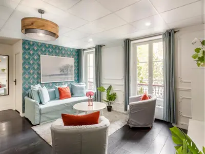 Coin salon dans l'établissement Merveil - Family Suite - Champs Elysees - Armee