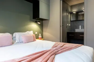 Un ou plusieurs lits dans un hébergement de l'établissement Les Appartements Cardinet