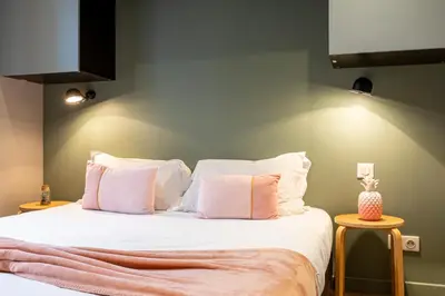 Un ou plusieurs lits dans un hébergement de l'établissement Les Appartements Cardinet