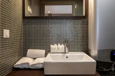 Salle de bains dans l'établissement Les Appartements Cardinet