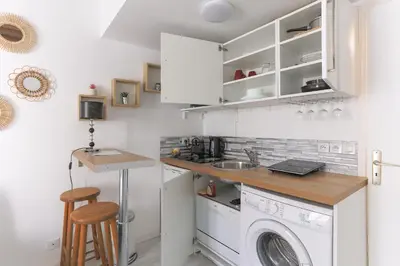 Cuisine ou kitchenette dans l'établissement Monceau Cozy Flat