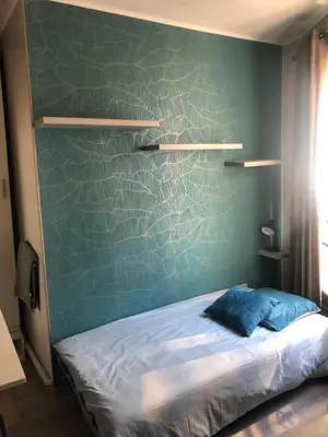 Un ou plusieurs lits dans un hébergement de l'établissement Cosy studio Paris 16 métro Exelmans
