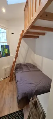 Un ou plusieurs lits dans un hébergement de l'établissement Cosy Studio in Montmartre