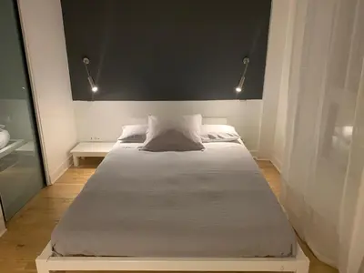Un ou plusieurs lits dans un hébergement de l'établissement Trés Beau Studio (face bois), 10mn de l'Etoile