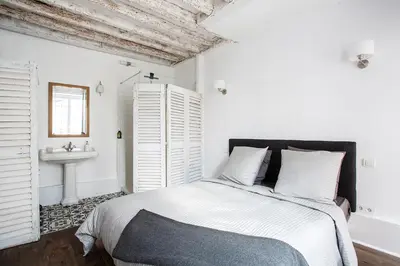 Un ou plusieurs lits dans un hébergement de l'établissement Appartement Gérard, tout équipé Paris 13éme