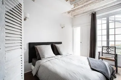 Un ou plusieurs lits dans un hébergement de l'établissement Appartement Gérard, tout équipé Paris 13éme