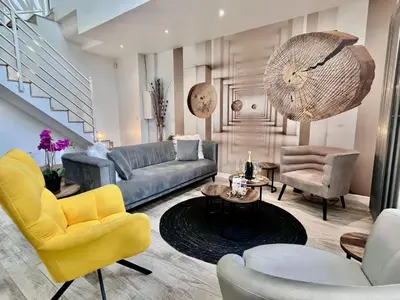 Coin salon dans l'établissement Duplex Design 6P - accès jardin et parking gratuit