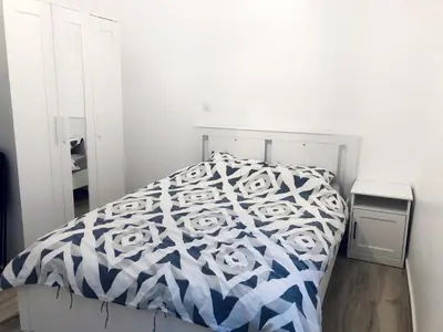 Un ou plusieurs lits dans un hébergement de l'établissement Appartement moderne & cosy au cœur de Paris