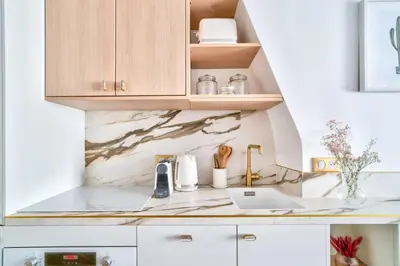 Cuisine ou kitchenette dans l'établissement Sompteux appartement proche de L'Opéra