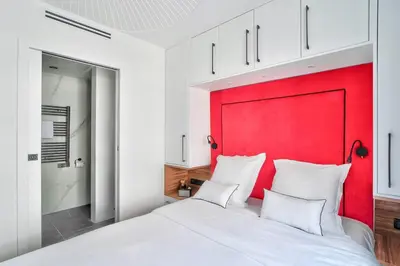 Un ou plusieurs lits dans un hébergement de l'établissement Sublime appartement au coeur de Paris