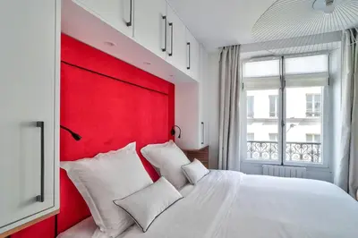Un ou plusieurs lits dans un hébergement de l'établissement Sublime appartement au coeur de Paris