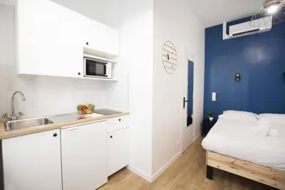 Un ou plusieurs lits dans un hébergement de l'établissement Superbe studio proche tour Eiffel