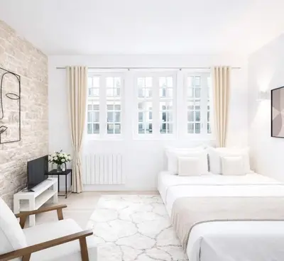 Un ou plusieurs lits dans un hébergement de l'établissement Louvre - Premium studio for 4