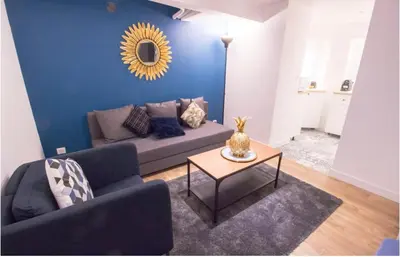 Coin salon dans l'établissement Bel appartement idéalement situé - Tour Eiffel