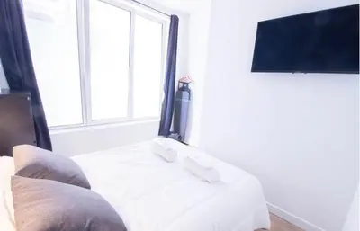 Télévision ou salle de divertissement dans l'établissement Bel appartement idéalement situé - Tour Eiffel