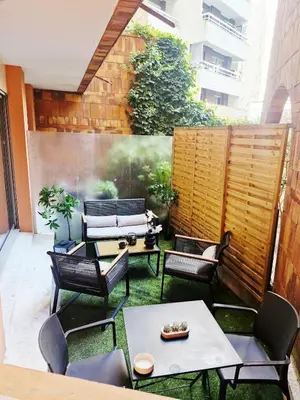 Coin salon dans l'établissement Bel Appartement Parisien