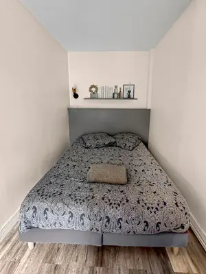 Un ou plusieurs lits dans un hébergement de l'établissement Bel Appartement Parisien