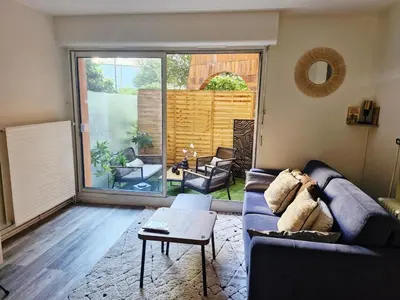 Coin salon dans l'établissement Bel Appartement Parisien