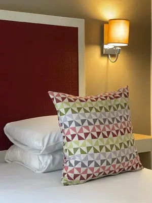 Un ou plusieurs lits dans un hébergement de l'établissement Kyriad Paris 18 - Porte de Clignancourt - Montmartre