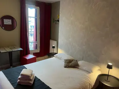 Un ou plusieurs lits dans un hébergement de l'établissement Le Montclair Montmartre by River